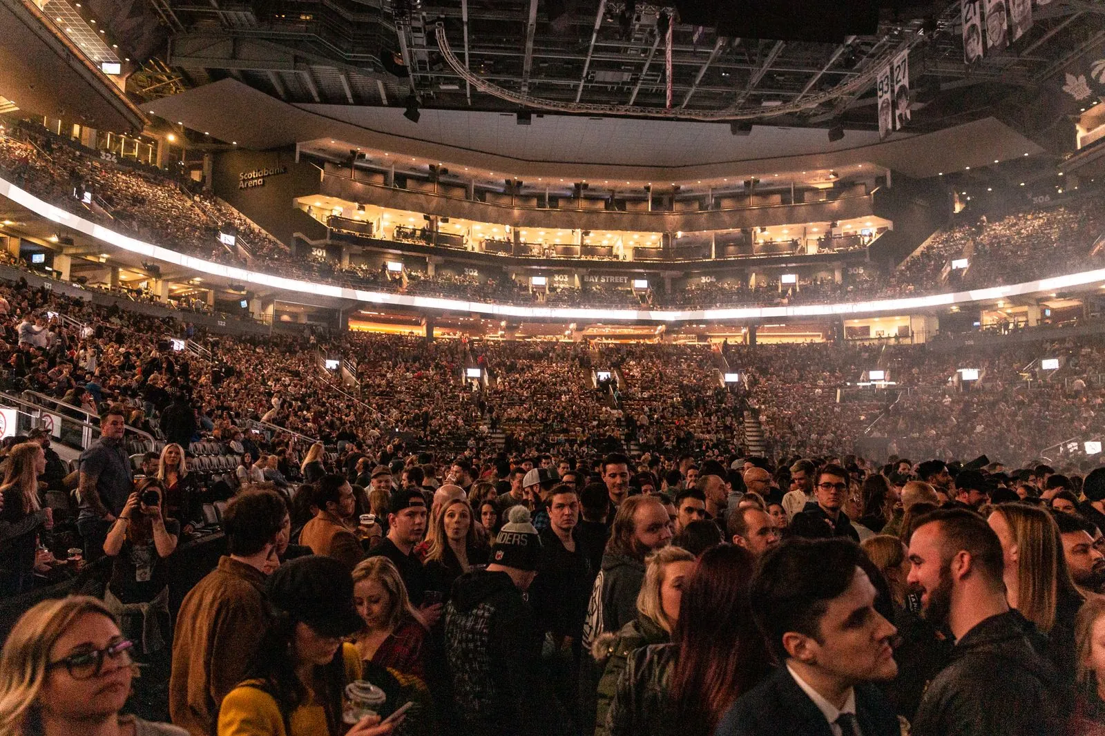 Large crowd in a brightly lit indoor arena