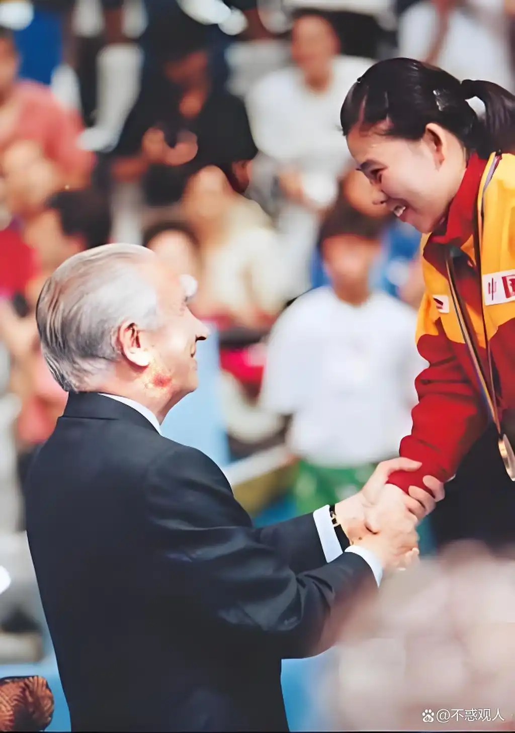 Deng Yaping on the Olympic podium receiving her gold medal