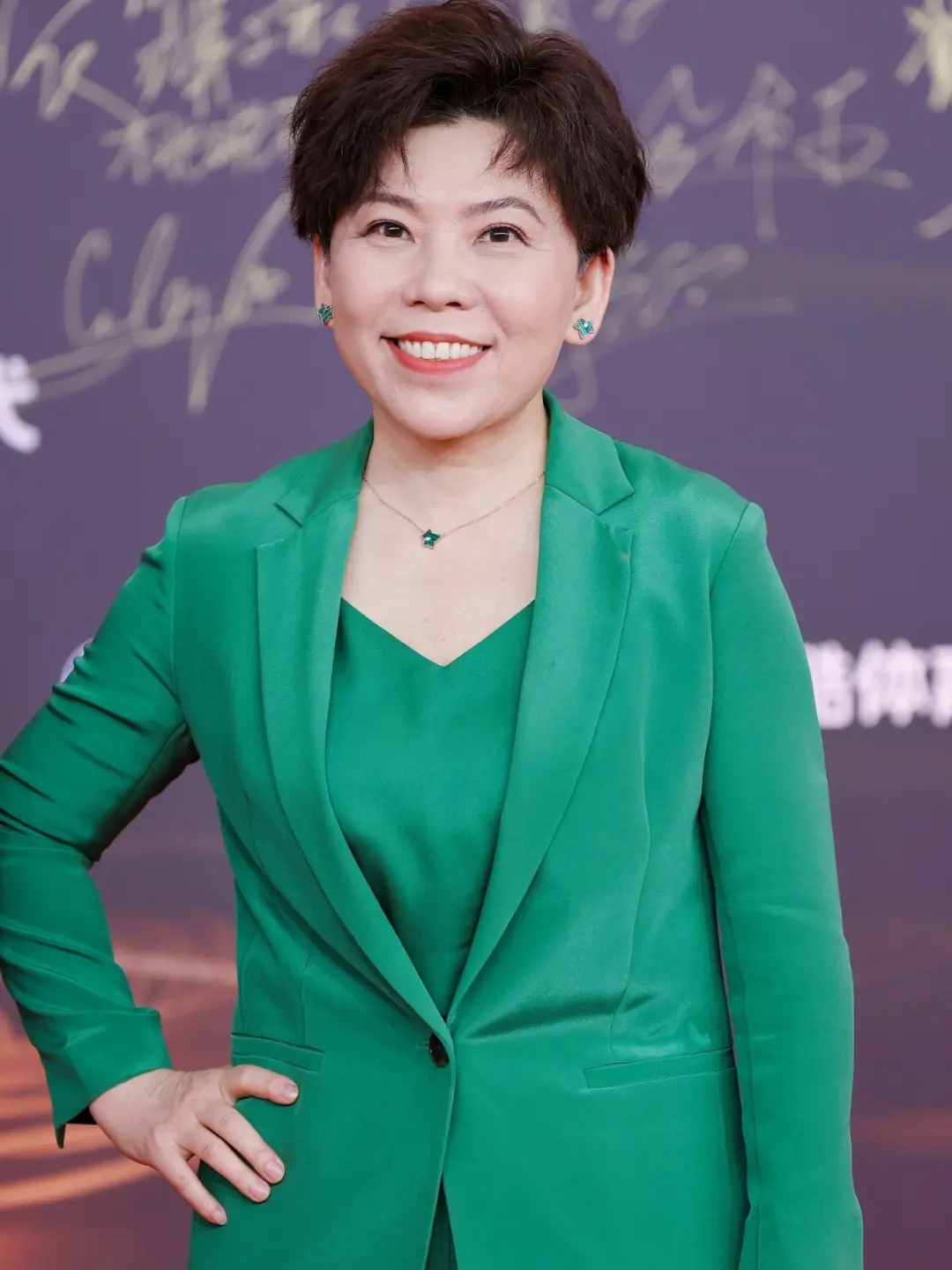 Deng Yaping in a calm portrait, looking directly at the camera