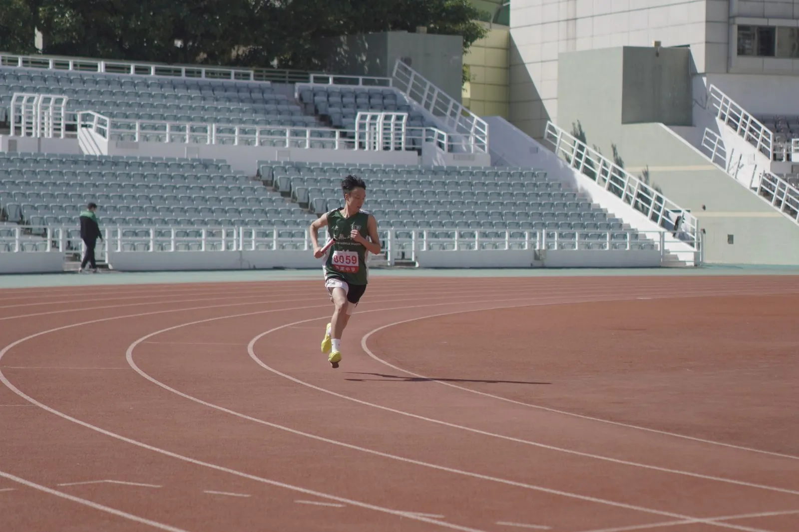 Athlete running on an outdoor track